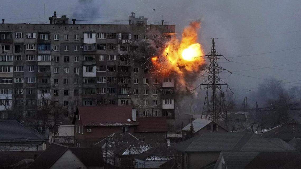An explosion in an apartment building in Mariupol, Ukraine, after a Russian army tank fired on it in March 2022.