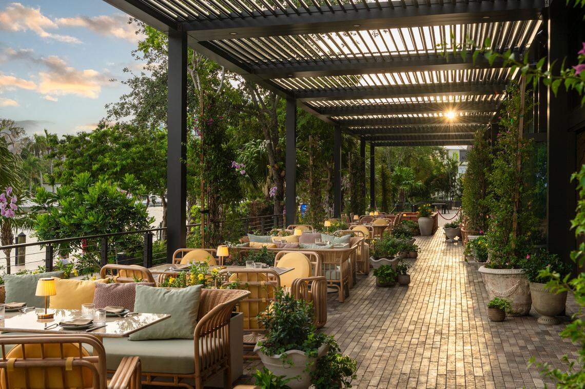 A daylight view of the outdoor patio at Elia Italian restaurant at River Landing in Miami.