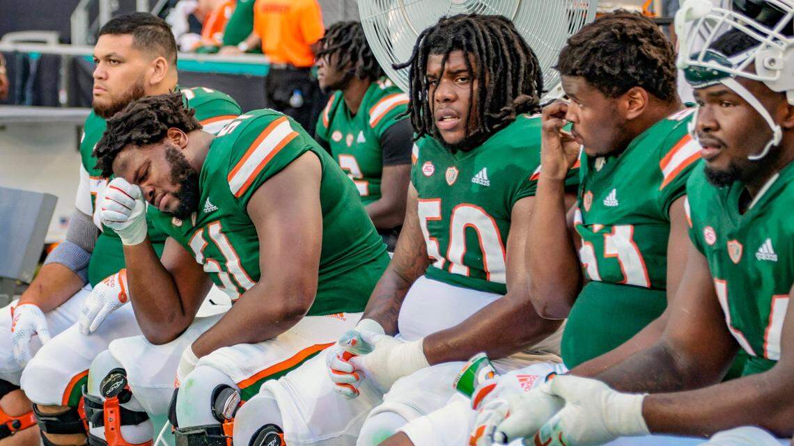 Miami Hurricanes offensive lineman DJ Scaife Jr. (51) sit on the bench as the team trails the Duke Blue Devils late in the fourth quarter at Hard Rock Stadium in Miami Gardens on Saturday, October 22, 2022.