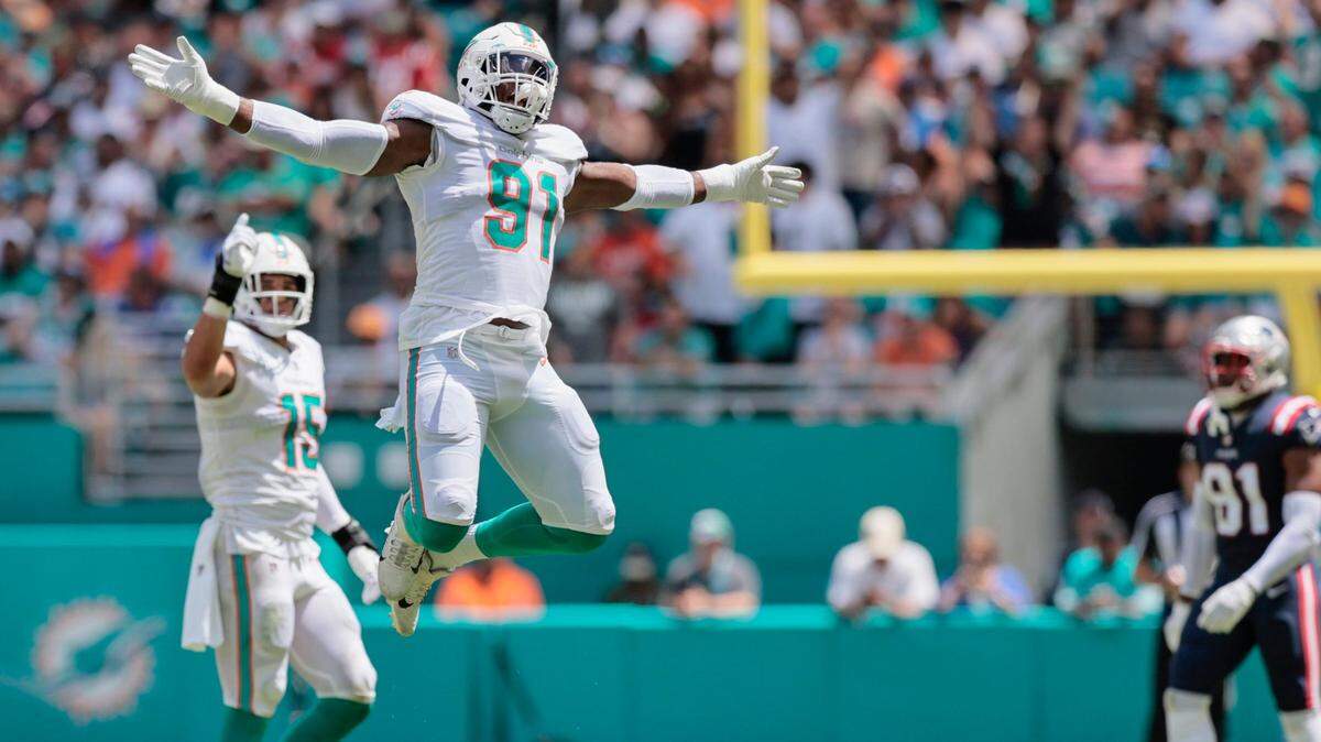 Miami Dolphins defensive end Emmanuel Ogbah (91) reacts after sacking New England Patriots quarterback Mac Jones (10) in the first quarter at Hard Rock Stadium in Miami Gardens on Sunday, September 11, 2022.