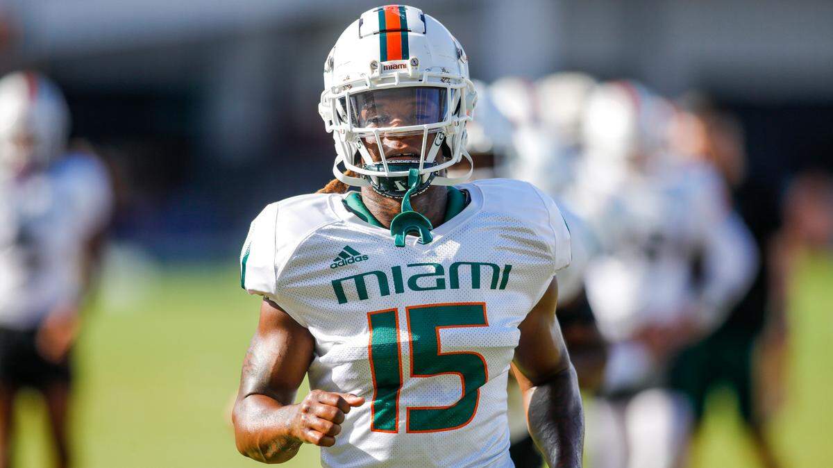 Miami Hurricanes safety Avantae Williams (15) runs on the field during football practice at the University of Miami campus in Coral Gables, Florida, Tuesday, August 23, 2022.