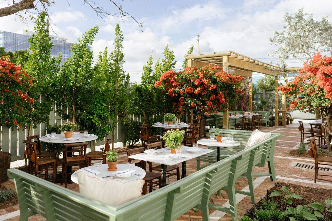 The outdoor garden and dining area at Rosemary’s Italian restaurant in Wynwood.