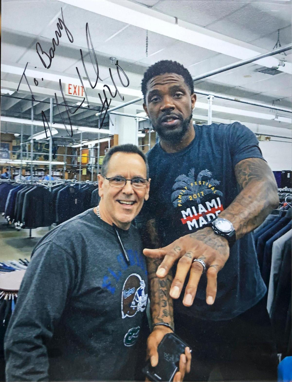 A photograph of Barry Burke and Miami Heat’s Udonis Haslem is on display inside the men’s clothing store Austin Burke.