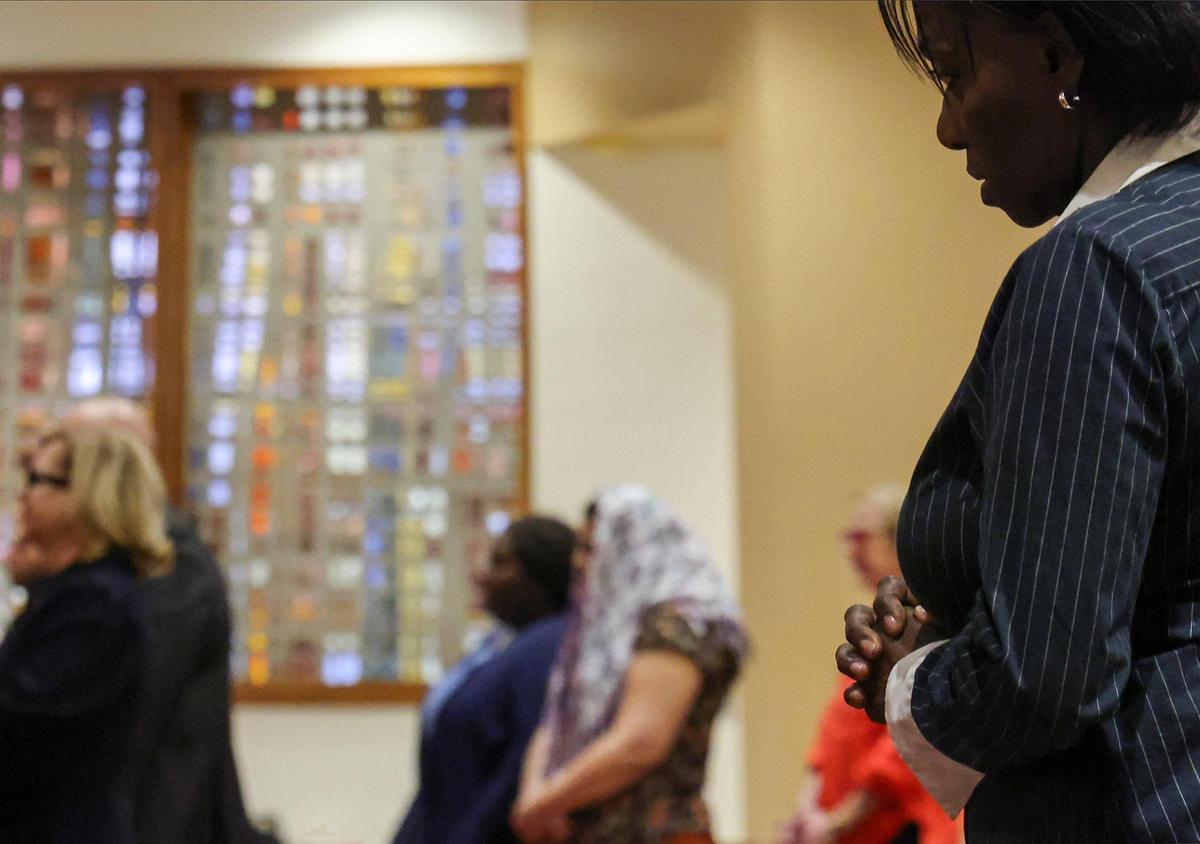 On the far right, Francisca Vente prays as Archbishop Thomas Wenski offered the first of the traditional nine Masses offered for the repose of the soul of Pope Francis at the Church of St. Martha on April 21, 2025, in Miami Shores, Florida.&nbsp;&nbsp;