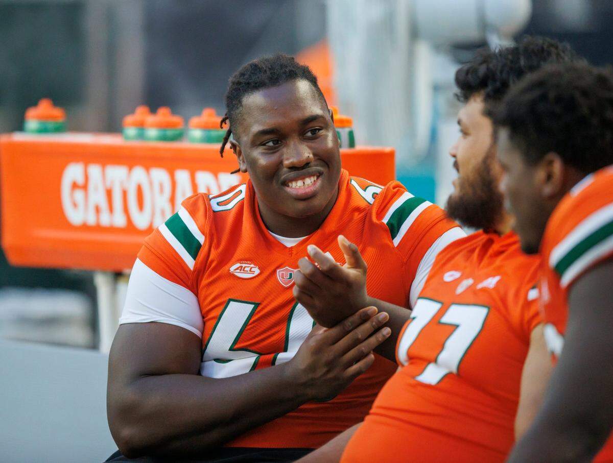 Miami Hurricanes offensive lineman Zion Nelson (60) looks from the bench during the fourth quarter of a NCAA non conference football game against Bethune-Cookman Wildcats at Hard Rock Stadium on Saturday, September 3, 2022 in Miami Gardens, Florida.