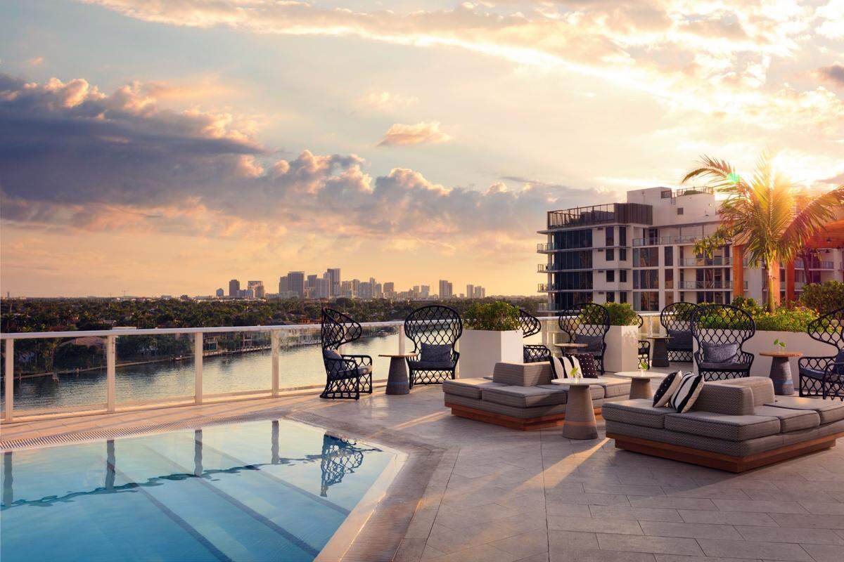 Chill out in style at Shorebreak — grab a cabana or daybed, soak up rooftop sunset vibes.