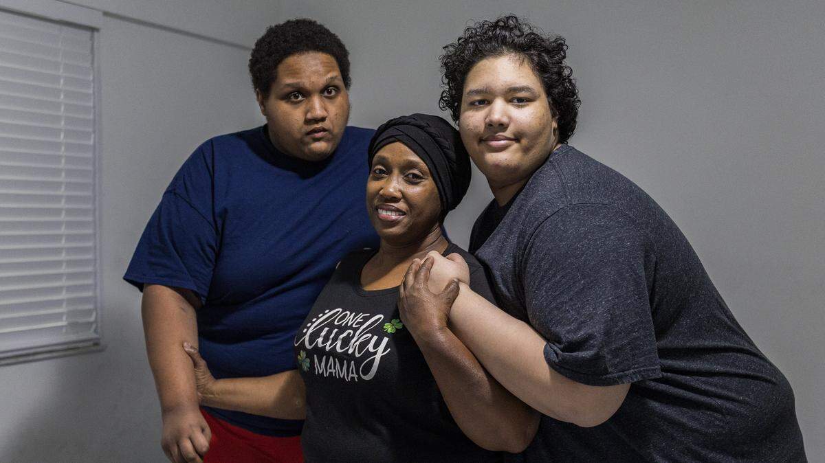 Fabiola Bodkin posed with her sons Ethan (left) and Liam at their apartment provided by the Homeless Trust after the family had been living in a motel and a homeless shelter following their eviction from an apartment. The instability of homelessness was especially tough on Ethan, who is severely autistic. 