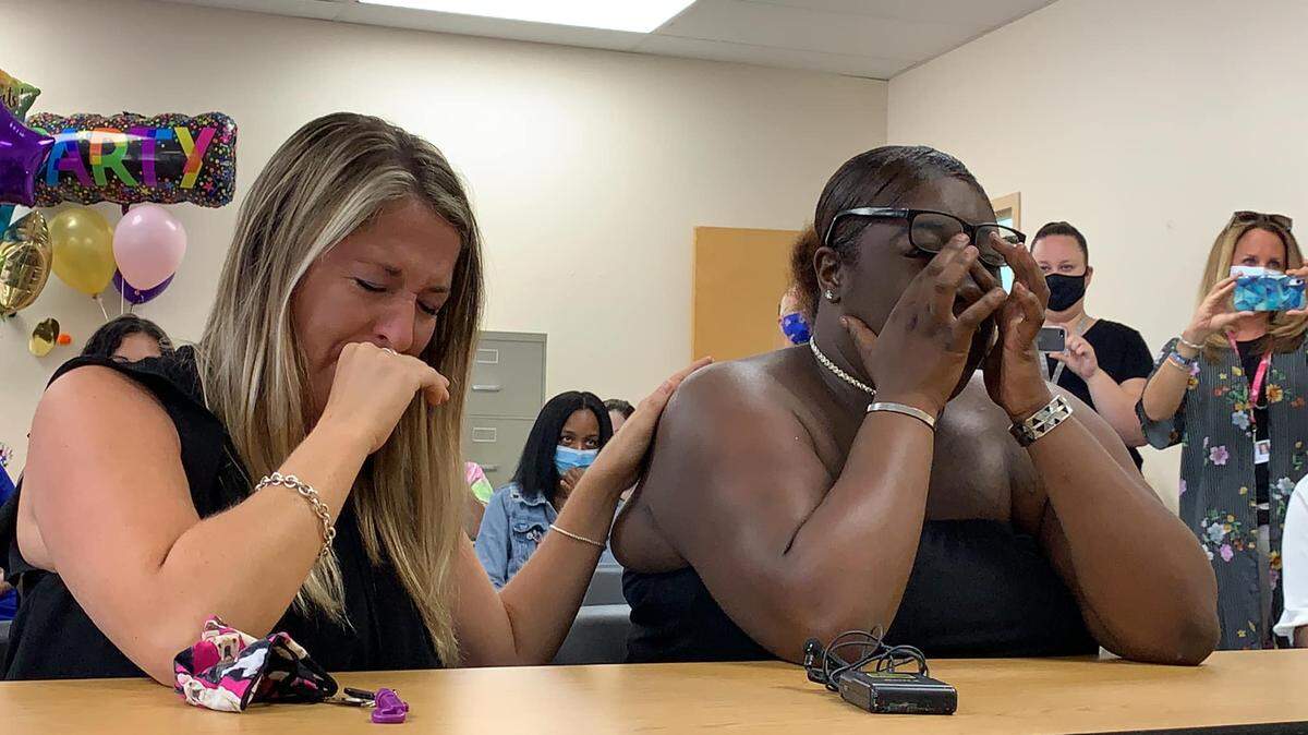 Leah Paskalides and Monyay Paskalides share tears as a judge pronounces Leah the legal adopted mom to adult Monyay at a ceremony at Safe Children’s Coalition in Bradenton, Florida, on April 27, 2021.