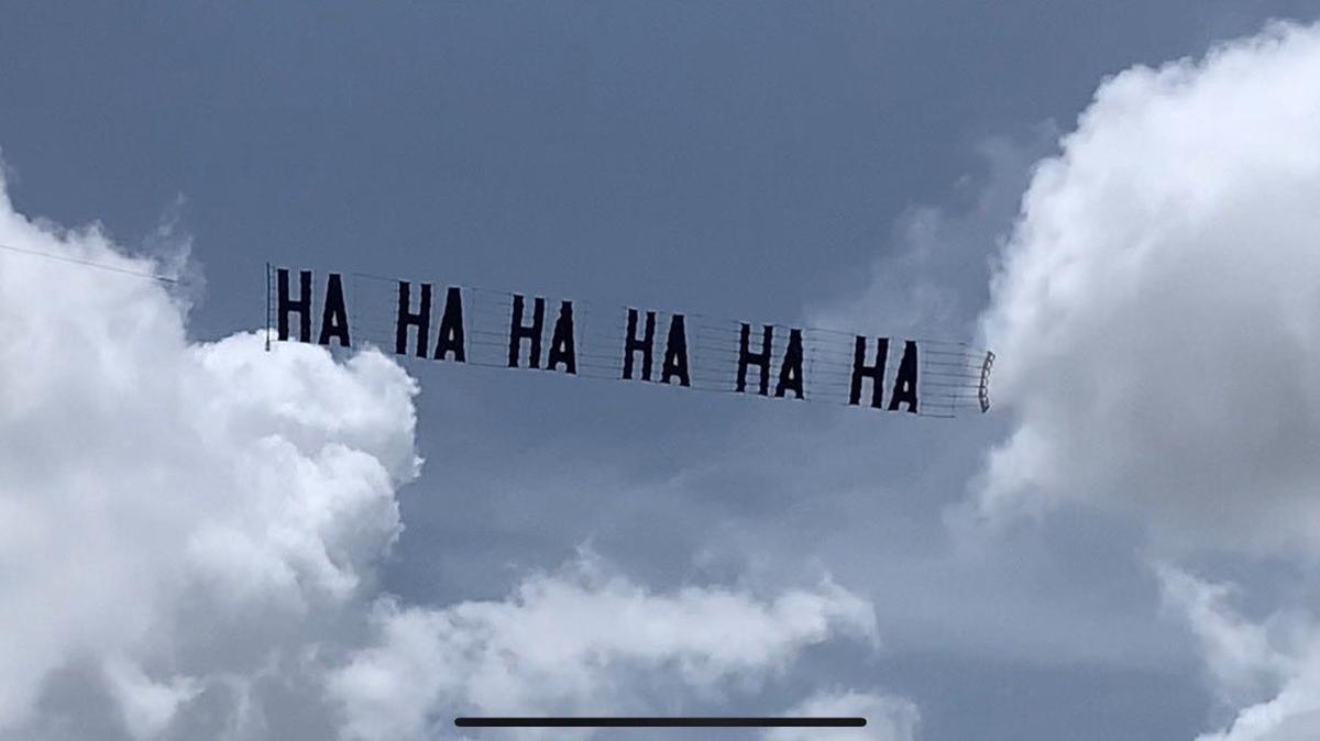 A banner plane flew over former President Donald Trump’s Mar-a-Lago residence in Palm Beach County on Aug. 11, 2022. with a mocking “Ha Ha Ha Ha Ha Ha” message aimed partly at Trump supporters who had gathered on the grounds as well as at Trump.