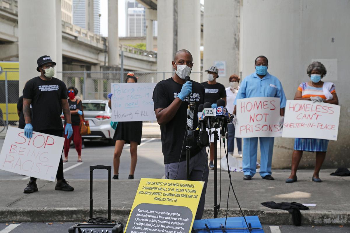 Dr. Armen Henderson, the UM doc who has been testing the homeless for COVID-19, is working with the Dream Defenders and other groups to demand resources and immediate action from the county and the Homeless Trust to help Miami’s vulnerable homeless population, Friday, April 17, 2020. The groups held a joint press conference in a parking lot Friday before taking to the streets and administering COVID-19 testing and passing out masks, tents and other necessities to those in need.