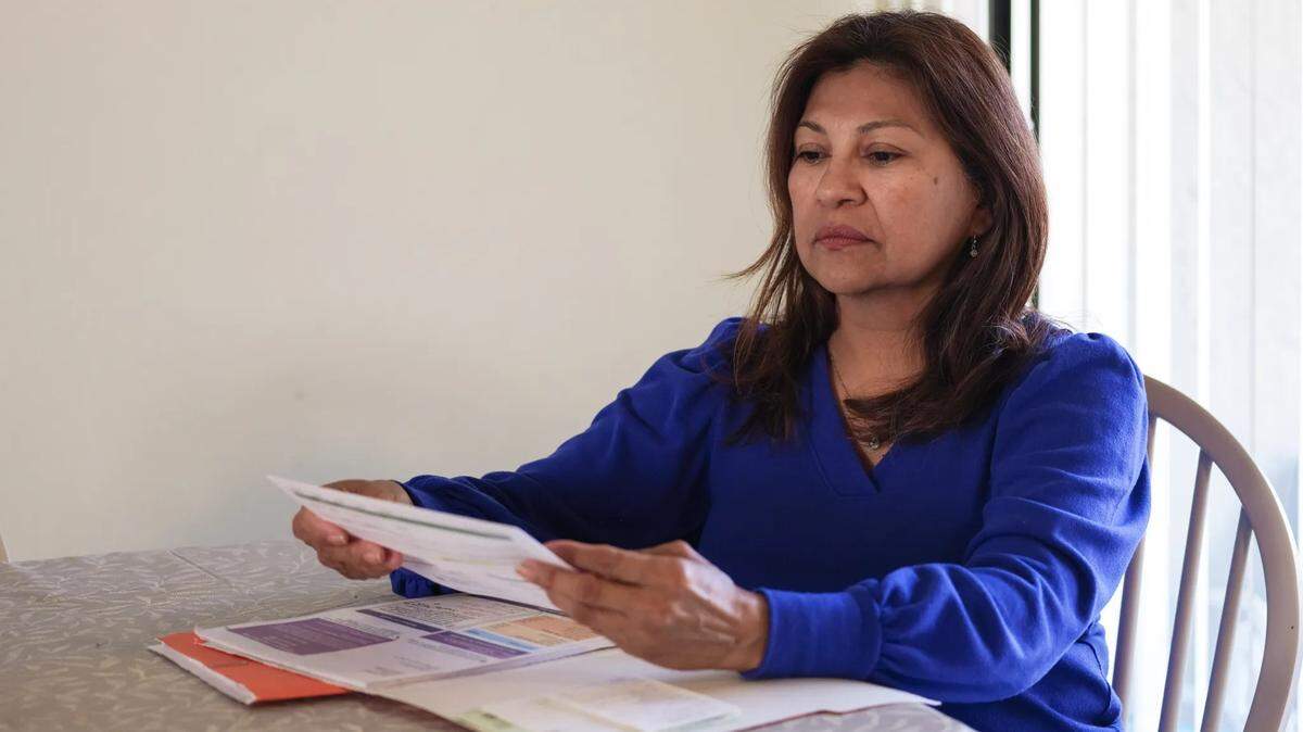 In the summer of 2025, Lorena Alvarado Hill, a teacher’s aide in Florida, was surprised to receive several medical bills for scans and other appointments that her government-subsidized insurance plan had previously covered. She learned her insurance had been canceled for non-payment of premiums — even though she owed just 5 cents.