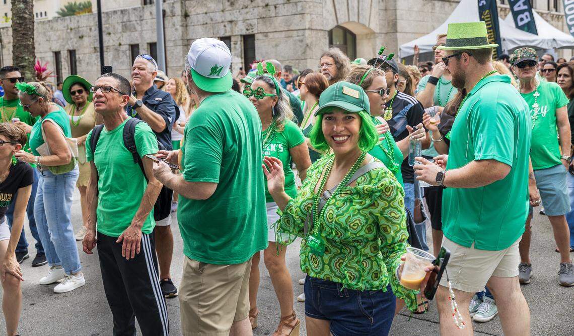 Attendees including Rebeca Pouchet danced the music beat of the band Wide Awake, while performing a U2 tribute, during the 33rd annual John Martin's St. Patrick's Street Festival in Coral Gables, presented by John Martin's Irish Pub & Restaurant, on Saturday, March 14, 2026.