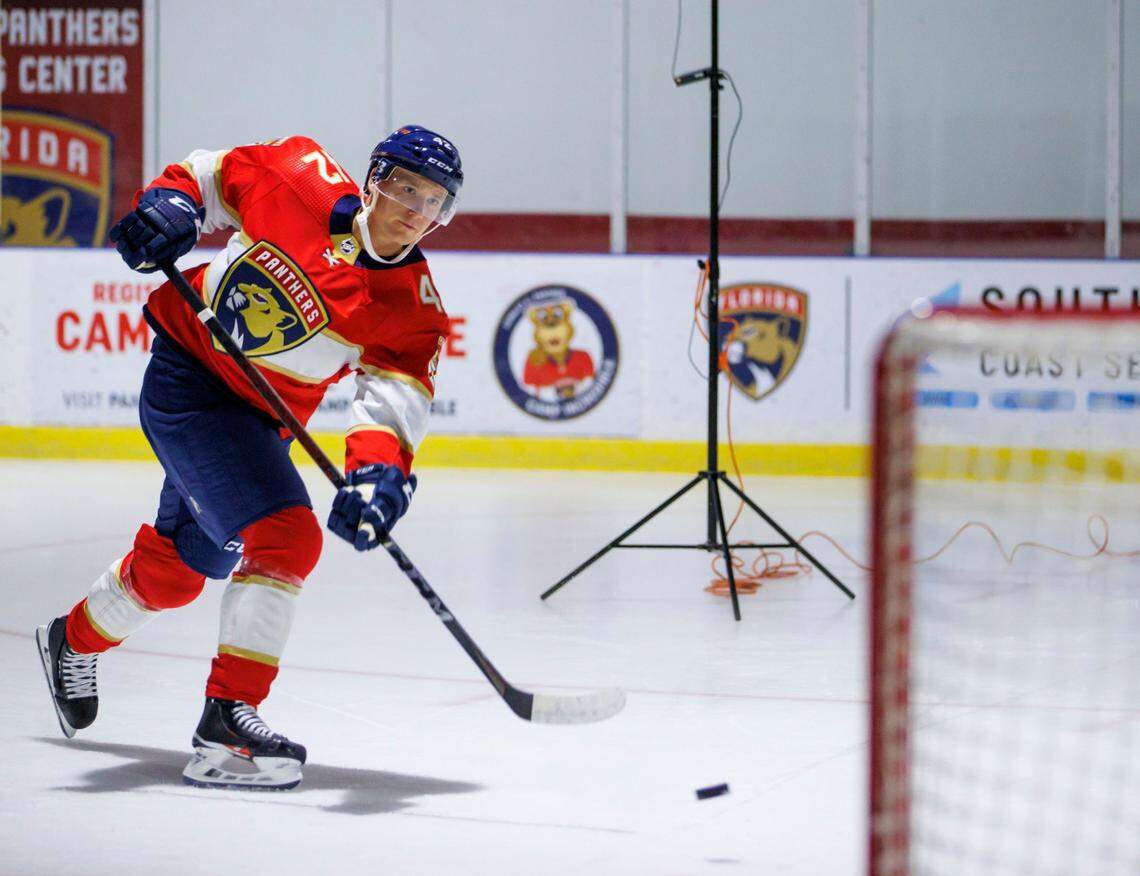 Florida Panthers defenseman Gustav Forsling takes a shot during team media day photo session at Florida Panthers IceDen on Wednesday, September 21, 2022 in Coral Springs, Fl.