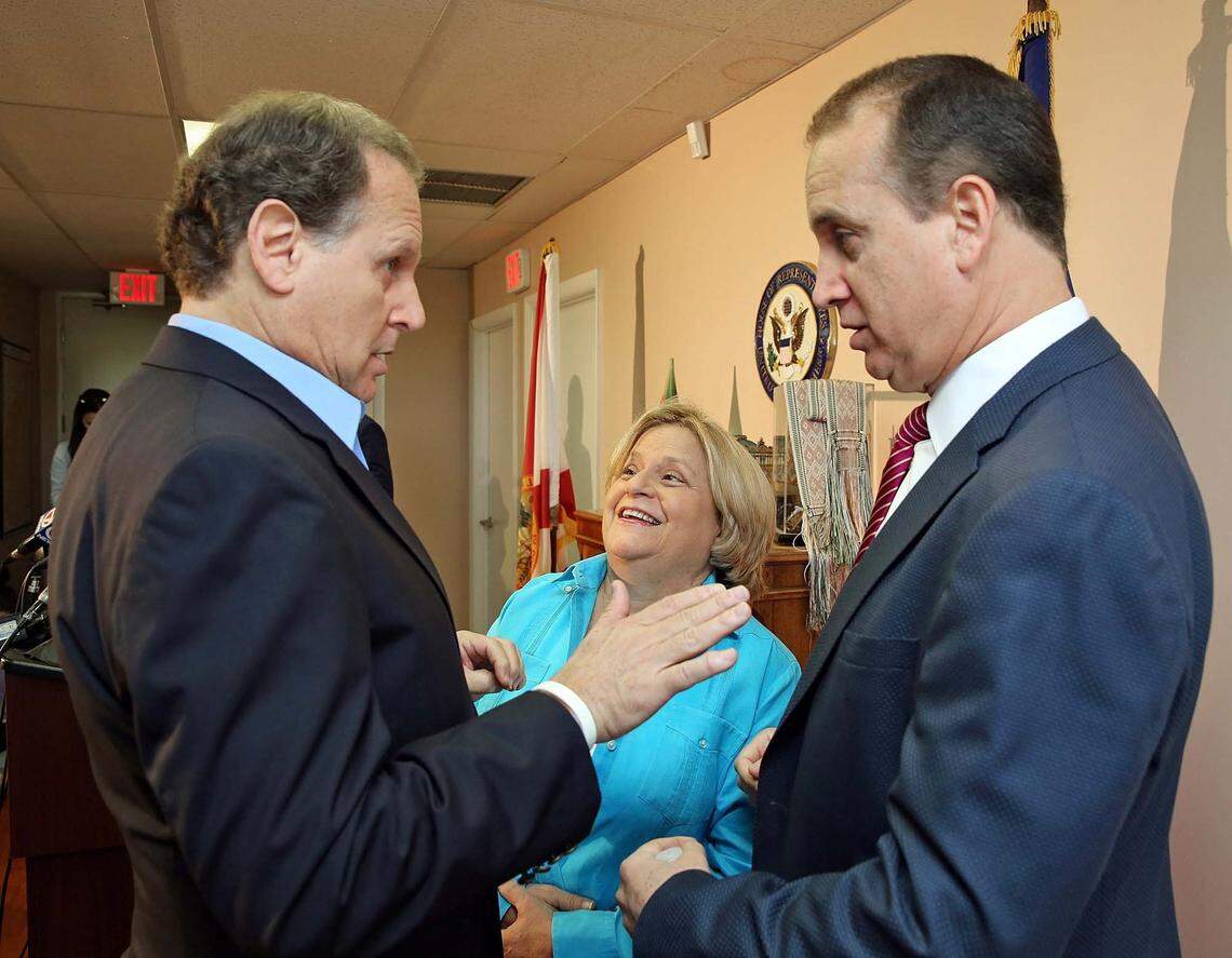 Former U.S. Rep. Ileana Ros-Lehtinen, middle, speaks with former Congressman Lincoln Diaz-Balart, left, and his brother Congressman Mario Diaz-Balart before a press conference after the death of Cuban dictator Fidel Castro on Saturday November 26, 2016