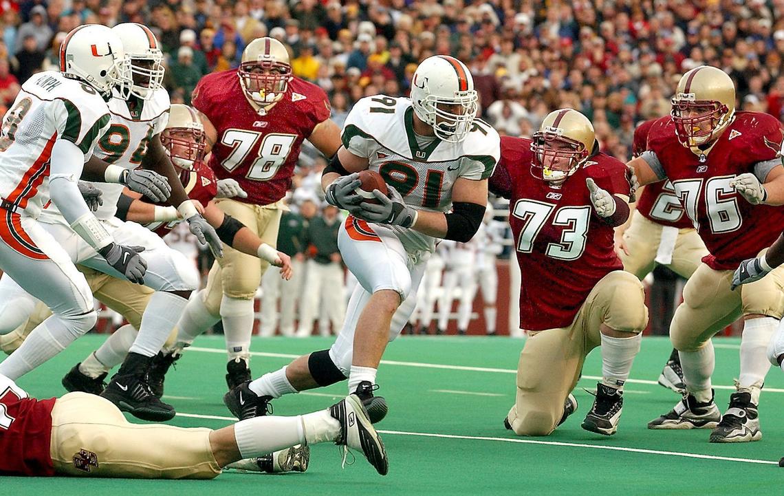 Miami lineman Matt Walter (91) intercepts a fourth-quarter pass thrown by Boston College’s Brian St. Pierre, Sunday, Nov. 10, 2001, in Boston. Miami won 18-7, extending the nation’s longest major college winning streak to 18 games. (AP Photo/Boston Herald, Michael Seamans)