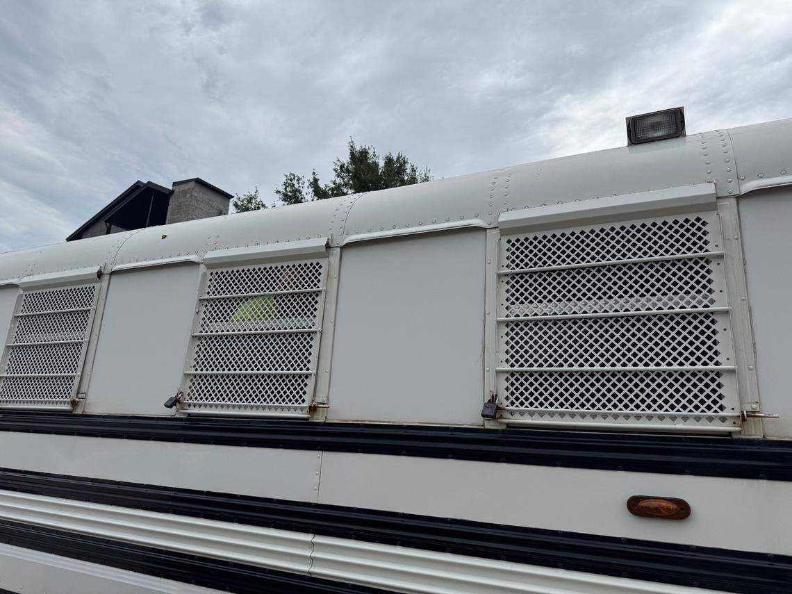 At least 30 individuals were detained and held in a white bus with grated windows as part of an immigration operation led by U.S. Immigration and Customs Enforcement on May 29, 2025.