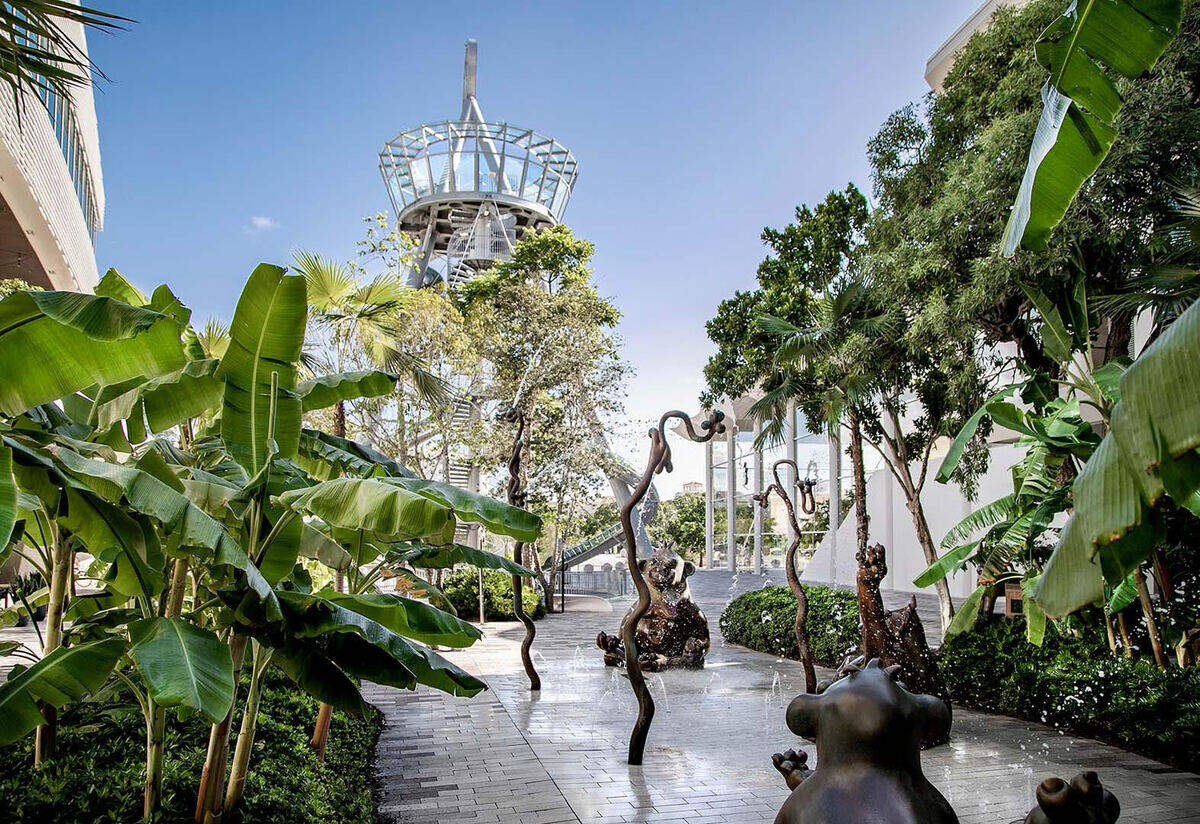 An outdoor corridor at Aventura Mall leads to the Carsten Höller’s 93-foot glass-and-steel slide.