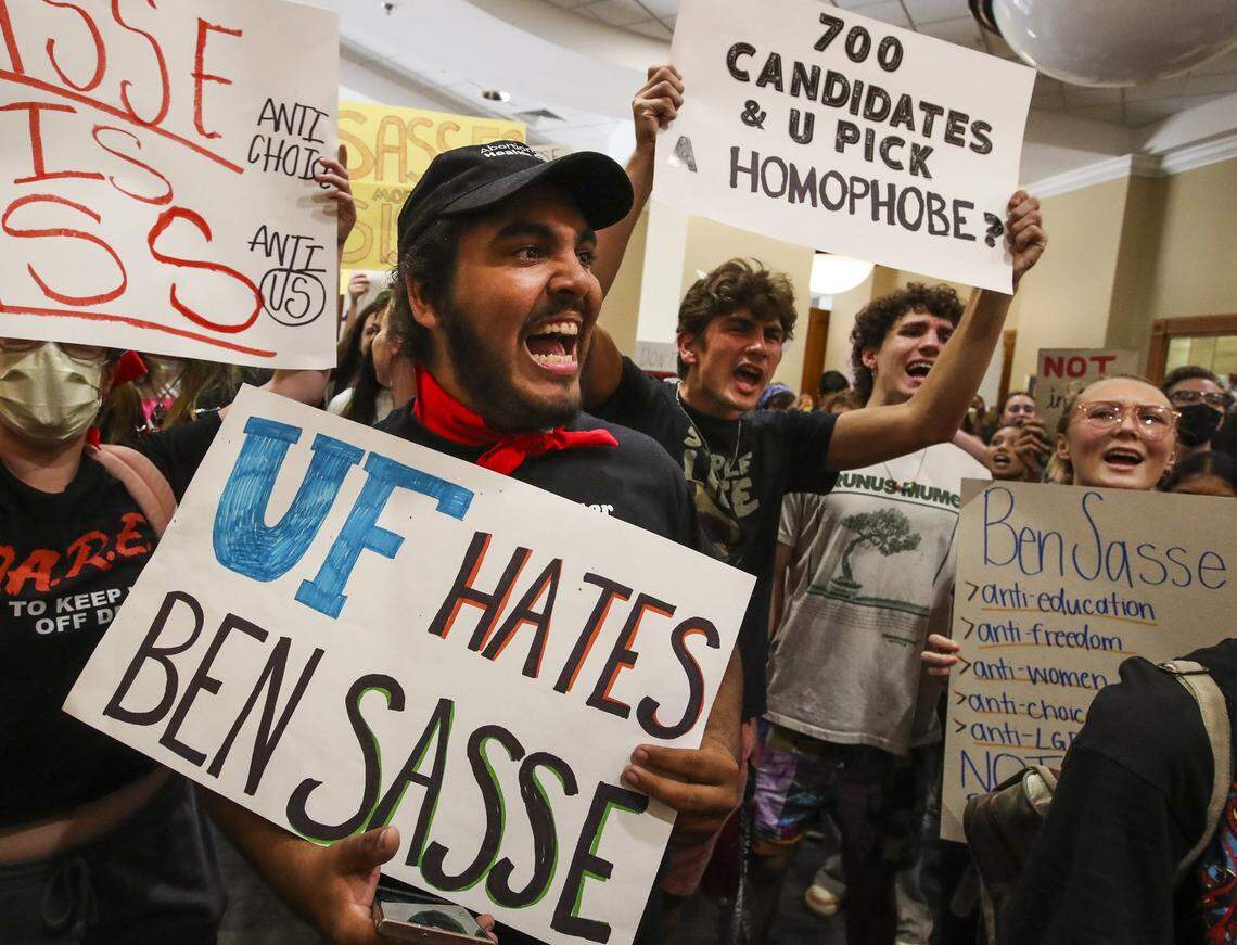 Aron Ali-McClory, a second-year UF student, leads a chant as students protest outside the President’s Ballroom at Emerson Alumni Hall at the University of Florida as U.S. Sen. Ben Sasse of Nebraska was scheduled to speak on Monday, Oct. 10, 2022. On Wednesday, Nov. 9, 2022, the Florida Board of Governors named Sasse the next president of the University of Florida.