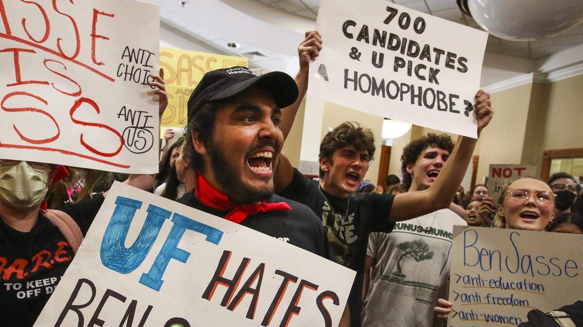 Aron Ali-McClory, a second-year UF student, leads a chant as students protest outside the President’s Ballroom at Emerson Alumni Hall at the University of Florida where U.S. Sen. Ben Sasse of Nebraska was scheduled to speak on Monday, Oct. 10, 2022. Sasse visited the Gainesville campus following Thursday’s announcement that he is the lone finalist to be the school’s next president On Tuesday, Nov. 1, UF named Sasse its next president..