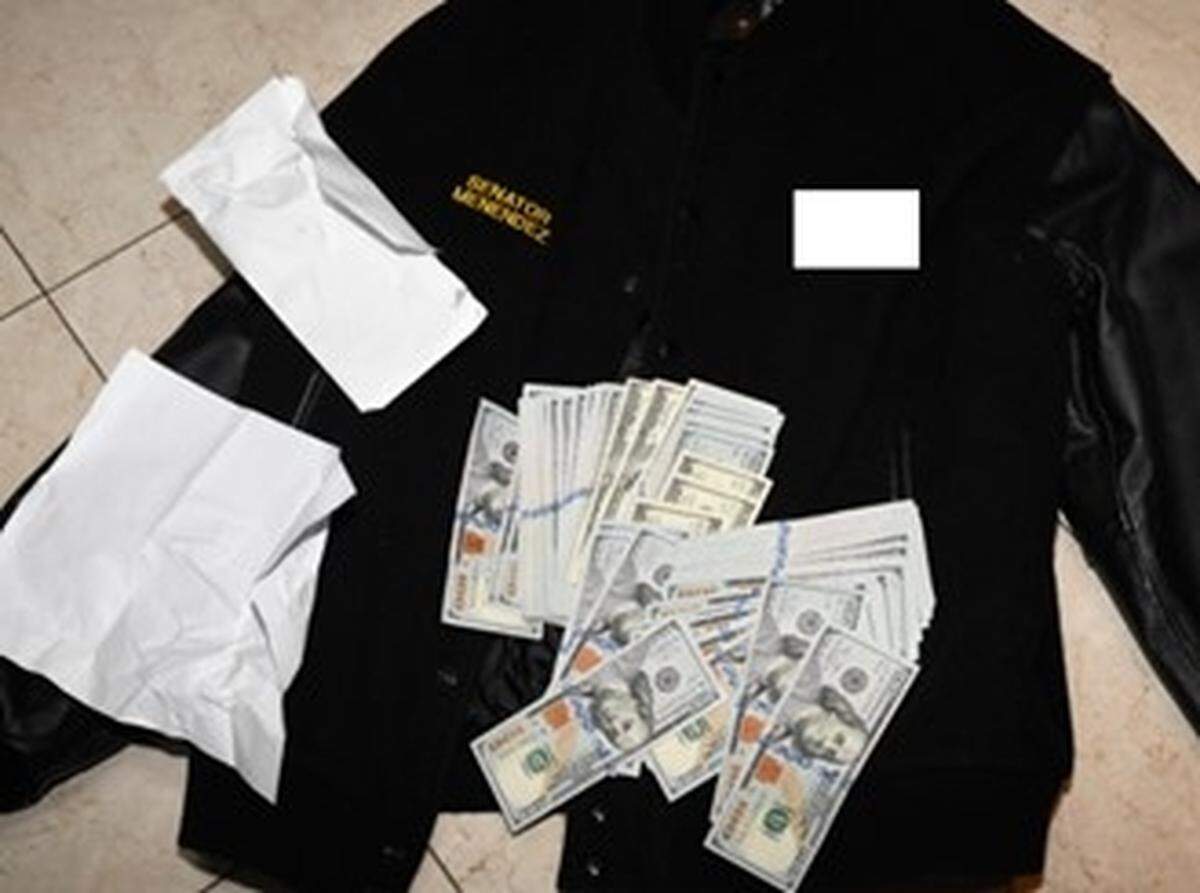 Photo of a jacket and some $500,00 in cash found stuffed in clothing and envelopes during a 2022 search by federal agents and pictured in the indictment against Sen. Bob Menendez, a New Jersey Democrat.