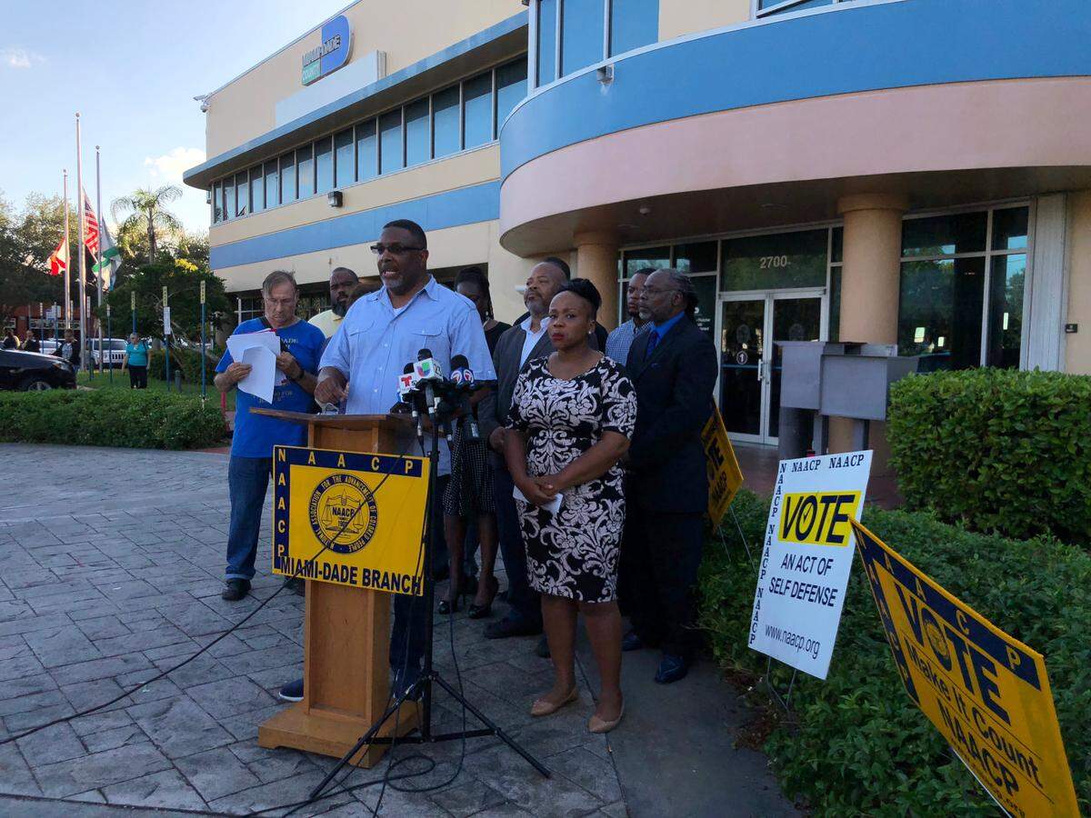 Miami-Dade NAACP President Ruban Roberts speaks to reporters outside the Miami-Dade elections office on Sunday, Nov. 11, 2018.