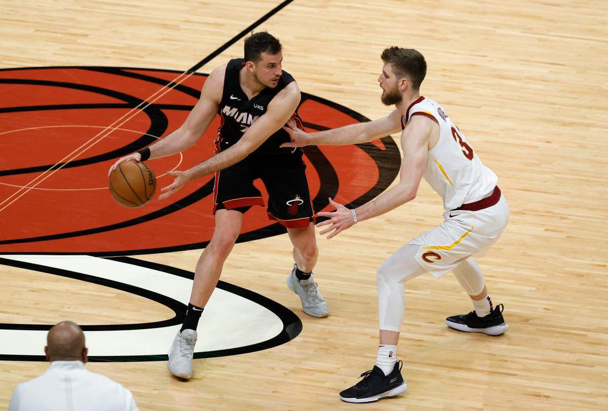 Miami Heat forward Nemanja Bjelica (70) drives against Cleveland Cavaliers forward Dean Wade (32) in the fourth quarter of their NBA basketball game at AmericanAirlines Arena on Saturday, April 3, 2021 in Miami.