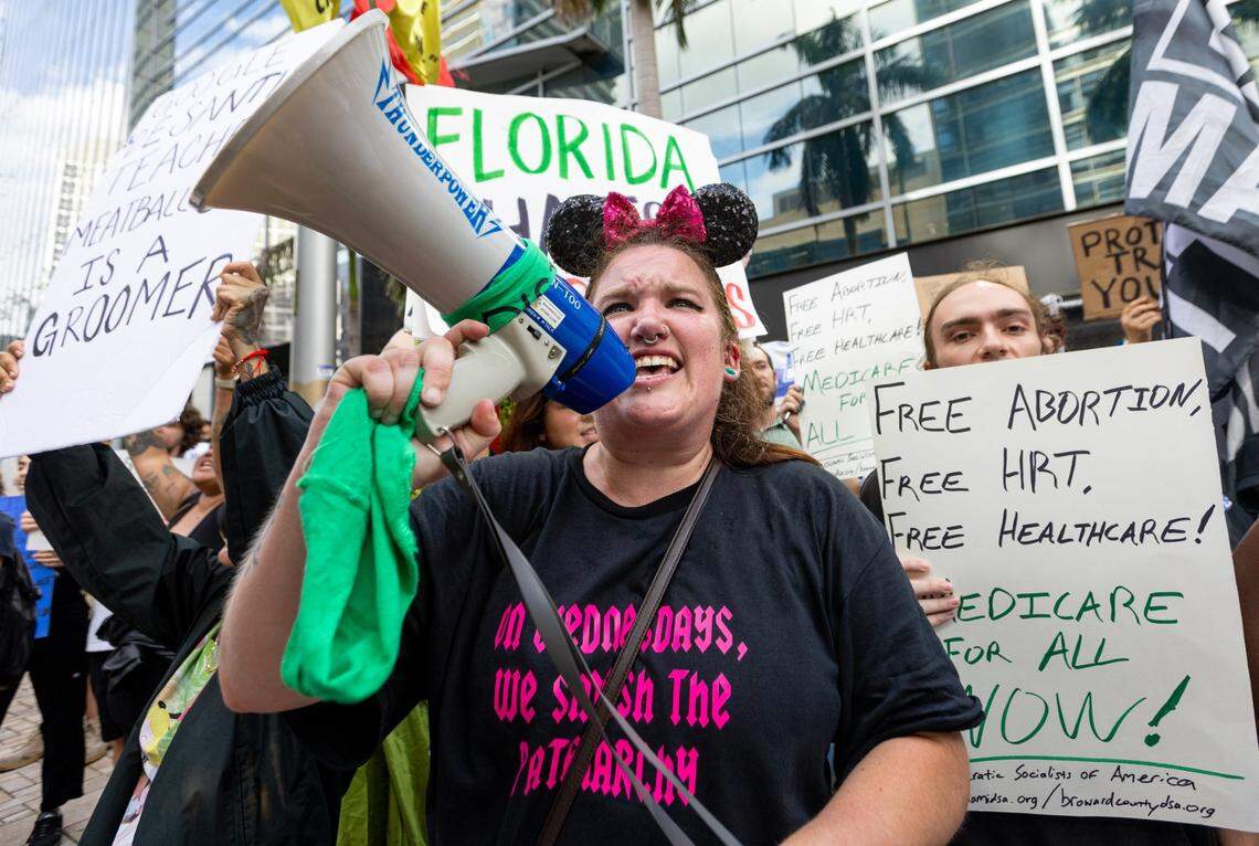 Protesters against Ron DeSantis demonstrate across the street from The Four Seasons in Miami, Florida, on Wednesday, May 24, 2023.