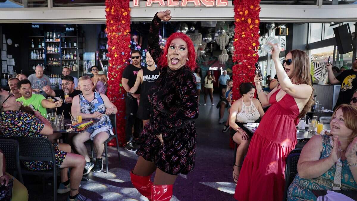 “Missy Meyake Lepaige,” center, engages the crowd with a dance and lip-sync performance at the Palace Sunday brunch in Miami Beach, Fla. The Palace, an LGBTQ + friendly bar and restaurant, is known for its high-energy weekend drag brunches, where performers entertain guests with choreographed dances, lip-syncs and audience interaction.
