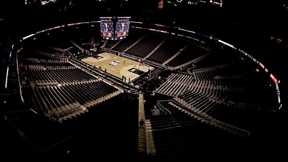 Big 12 commissioner Bob Bowlsby is seen on the big screen in an empty Sprint Center as he talks to the media after canceling the remaining games of the NCAA men’s college basketball tournament due to concerns about the coronavirus Thursday, March 12, 2020, in Kansas City, Mo. (AP Photo/Charlie Riedel)