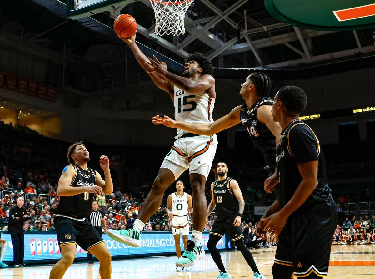Miami Hurricanes forward Norchad Omier (15) drives to the basket over La Salle Explorers defenders in the second half at an NCAA basketball game at the Watsco Center in Coral Gables, Florida on Saturday, December 16, 2023.