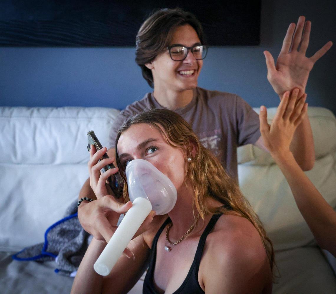 The Voice Dampener is the gift of choice for that loudmouth in your life. Pictured, Kaia Zaney and Rocco Palladino