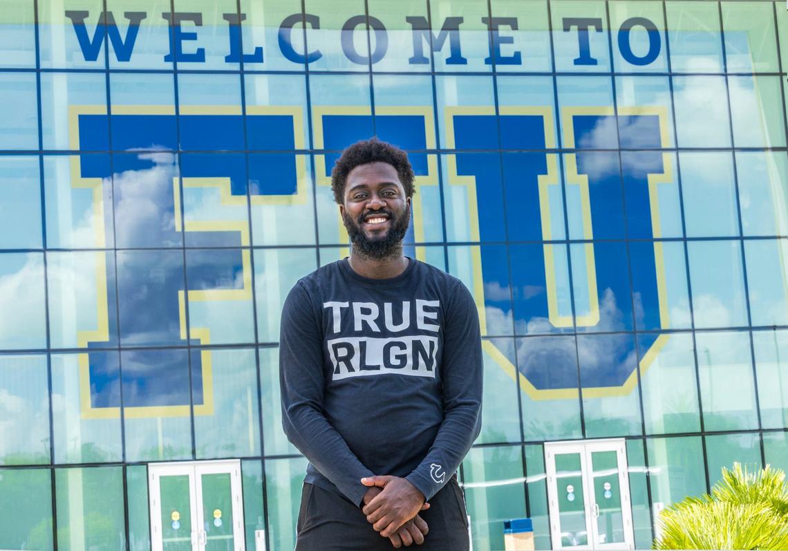 Edson Clervil, a junior majoring in electrical engineering at Florida International University, left Haiti due to the violence when he was 13. The lawyers at CABA Pro Bono in Miami helped him get his green card, which enabled him to enroll in FIU. He is in front of the Student-Athlete Academic Center at FIU’s main campus.