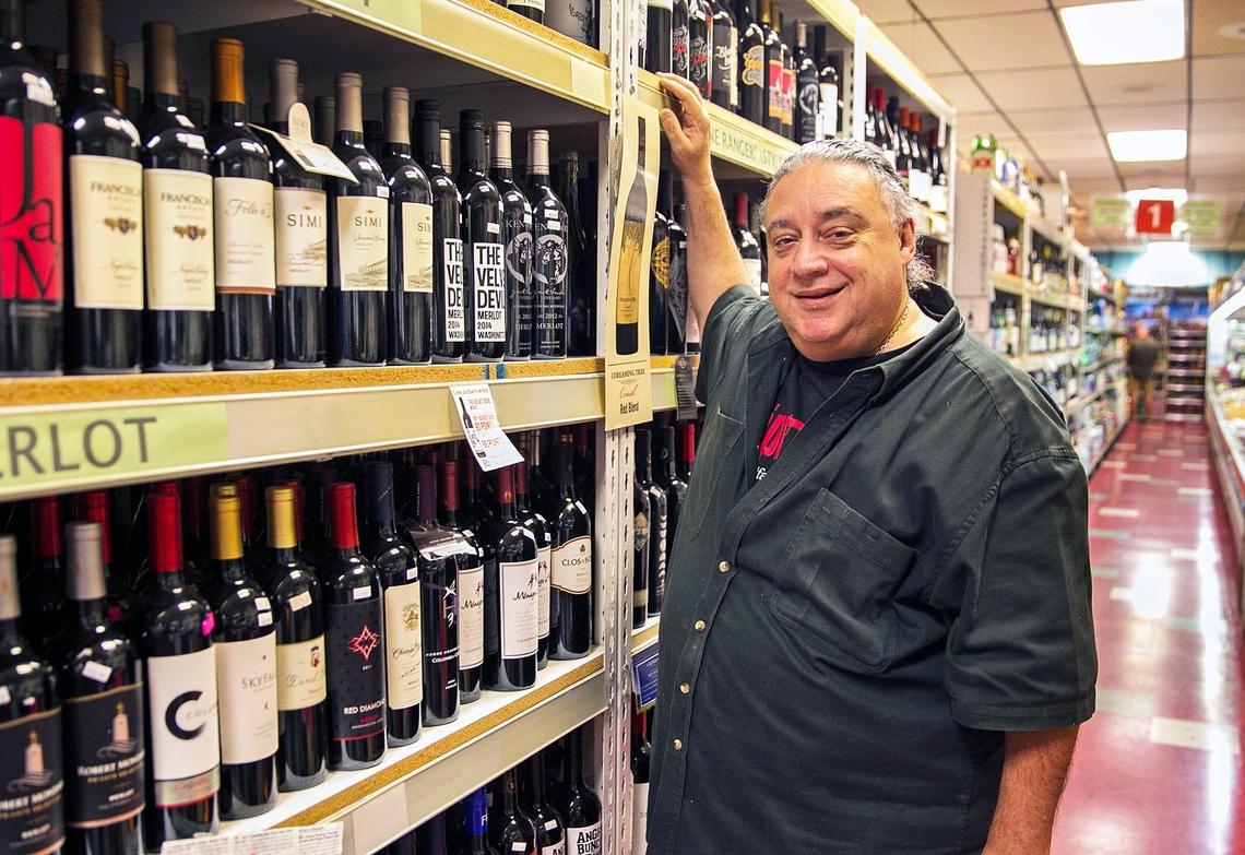 David Laurenzo, owner of Laurenzo's Italian Market & Cafe in North Miami Beach, stands in the extensive wine section of the store on Friday, June 22, 2018.