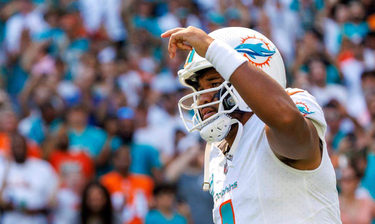\Miami Dolphins quarterback Tua Tagovailoa (1) rushes the field during introductions before the start of an NFL football game against the Carolina Panthers at Hard Rock Stadium on Sunday, Oct. 15, 2023 in Miami Gardens, Fl.