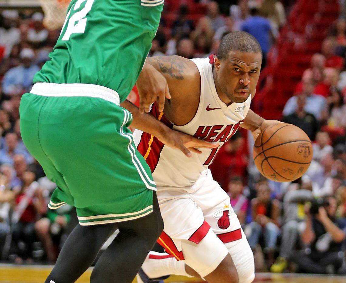Miami Heat Dion Waiters (11) pushes his way around Boston Celtics Terry Rozier (12) in the second quarter at the AmericanAirlines Arena in Miami, Florida, Wednesday, April, 3, 2019.