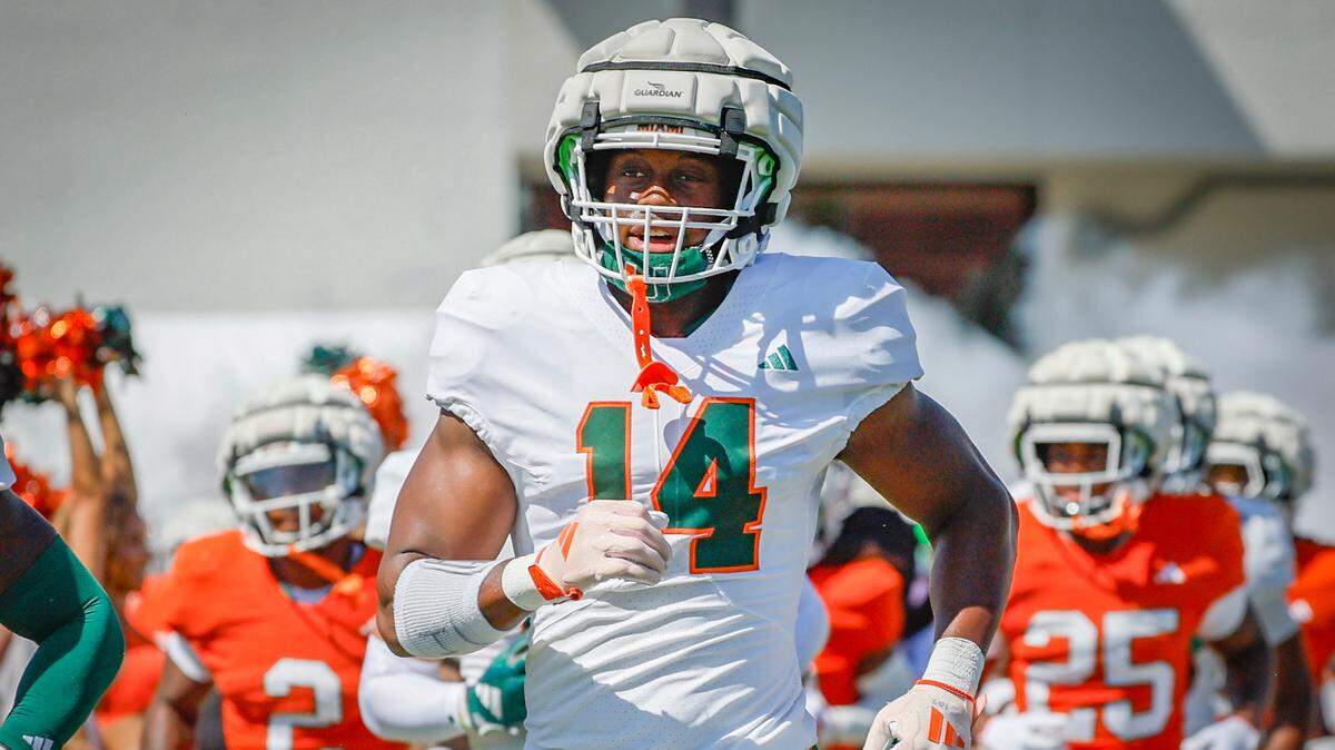 University of Miami defensive lineman Hayden Lowe rushes the field with teammates before the Miami Hurricanes football spring game on at Cobb Stadium on UM’s campus in Coral Gables, Florida on Saturday, April 12, 2025. 