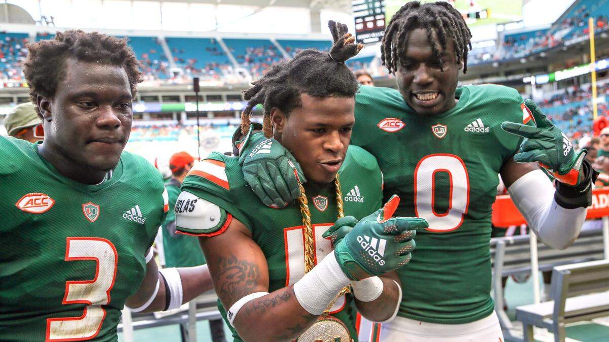 Miami Hurricanes safety Avantae Williams (15) celebrates after intercepting the ball intended for Georgia Techs Tariq McGowan (2) in the first half at Hard Rock Stadium in Miami Gardens on Saturday, November 6, 2021