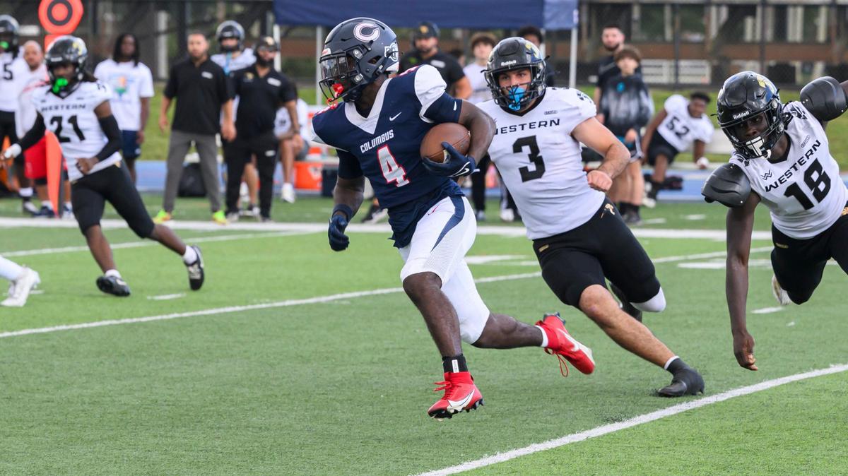 Columbus High School Safety Shaddai Carter (4) runs the ball during the game at Tropical Park on Friday, Nov. 29, 2024 in Miami, Fla. (Ruben Gonzalez/Miami Herald)