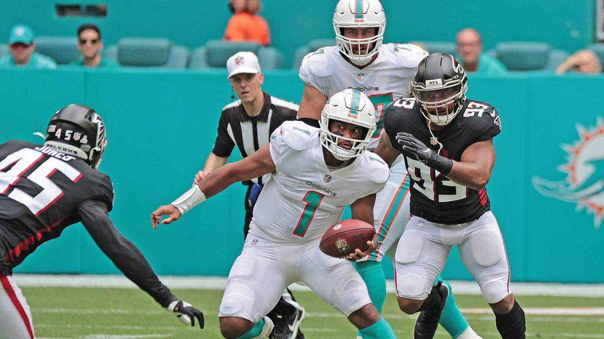 Miami Dolphins quarterback Tua Tagovailoa (1) scrambles for a first down against the Atlanta Falcons in the first half at Hard Rock Stadium in Miami Gardens on Sunday, October 24, 2021.