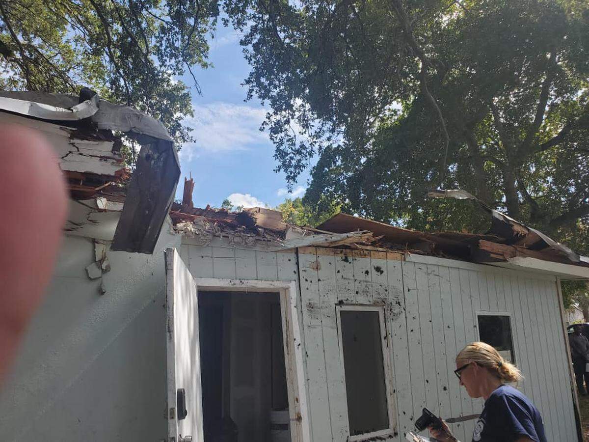 The roof of a duplex after a Lamborghini crashed into it.