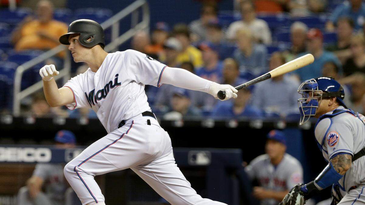 Miami Marlins third baseman Brian Anderson hits an RBI double in the first inning of the Miami Marlins vs New York Mets, game at the Marlins Park in Little Havana in Miami on Tuesday April 02, 2019.