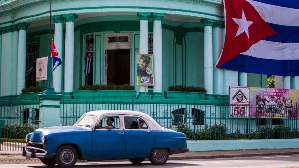 On Nov. 26, 2016, the day after former Cuban President Fidel Castro died, a flag flies at half staff at the headquarters of the Committees for the Defense of the Revolution in Havana.