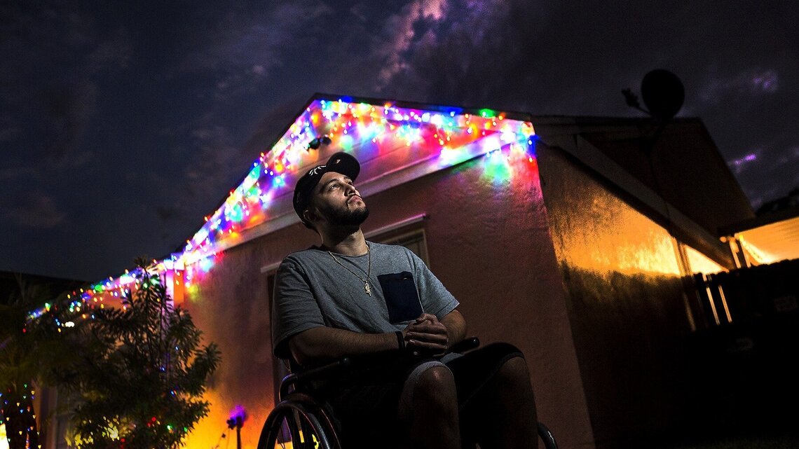 His life changed in a flash after being shot in the back. He now struggles in his home