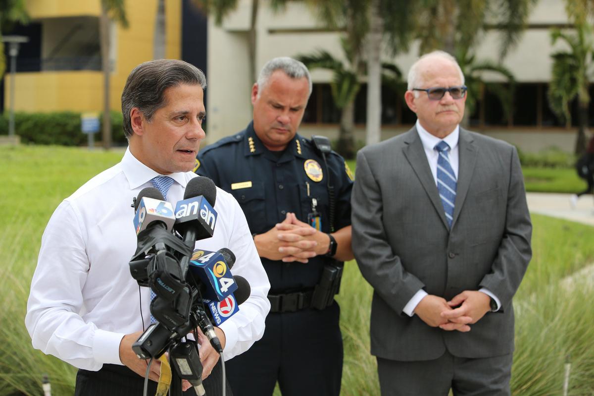 From left, Miami-Dade Schools Superintendent Alberto Carvalho, Florida International University Police Chief Alexander Casas and FIU President Mark Rosenberg speak at a press conference Tuesday morning.   A 16-year-old boy and a 15-year-old girl, both students at MAST Academy-FIU, were attacked in an area of FIU’s Biscayne Bay campus that police call ‘the wooded area,’ on Monday morning Sept. 10, 2018.