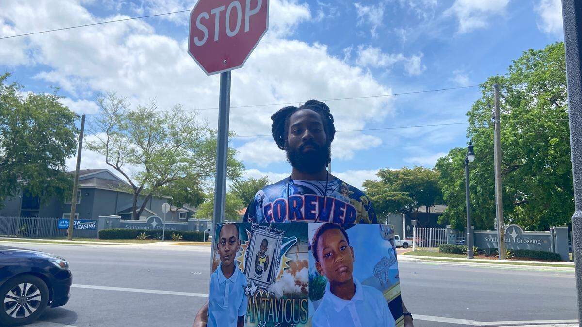 Quintavian Williams on Tuesday, April 22, 2025, holds a photograph of his nephew, Antavious Scott, who was shot and killed in Florida City on Nov. 16, 2024.
