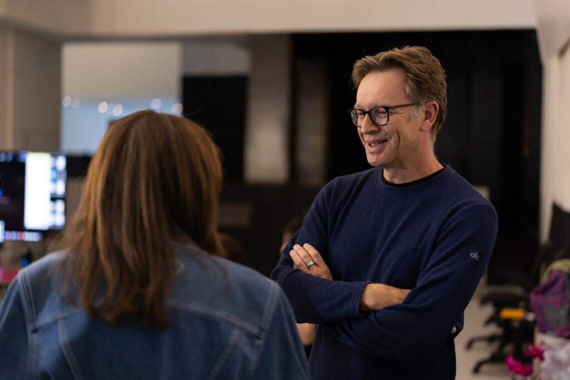 Playwright Nicolas Griffin with Stacey Mindich, co-chair of the Miami New Drama board talk during “English Only’s” first rehearsal.