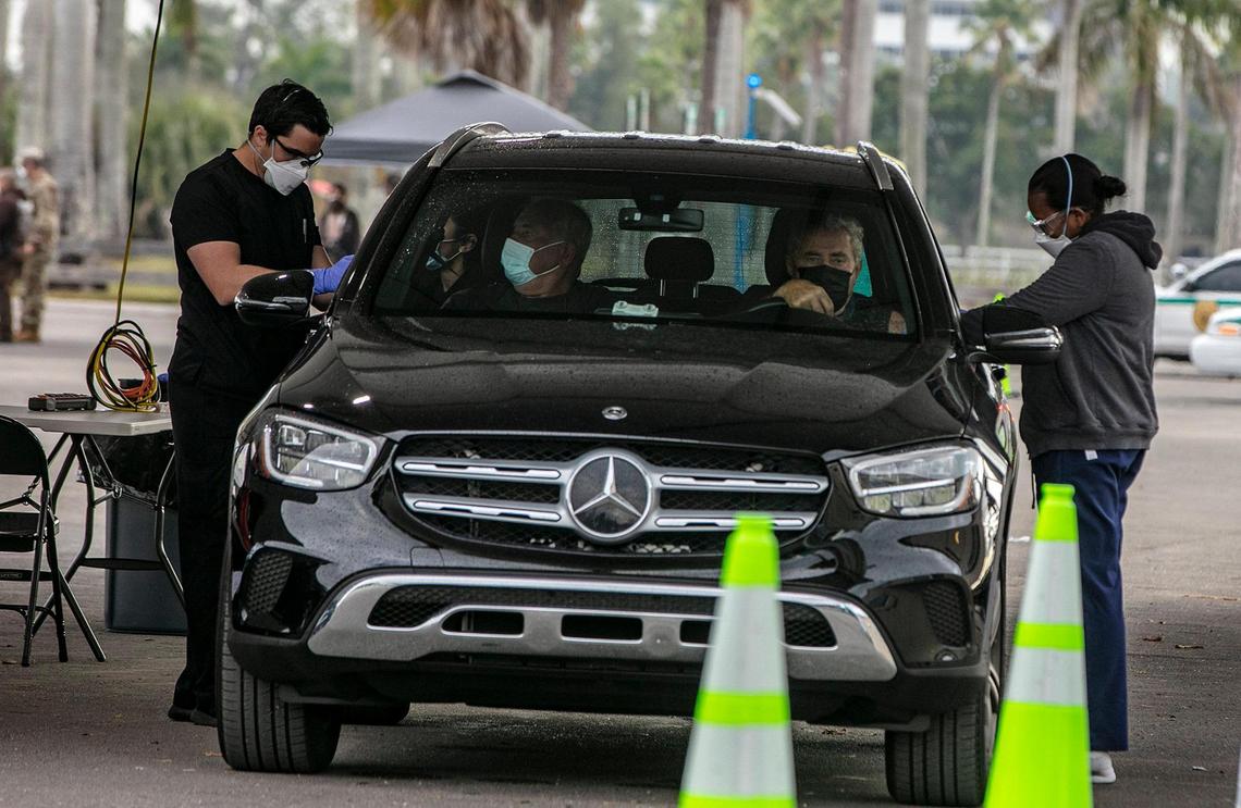 Nurses give the Covid-19 Vaccine shot to Miami-Dade County residents with appointments at the Tropical Park Covid test site in Miami. on Wednesday, January 13, 2021.