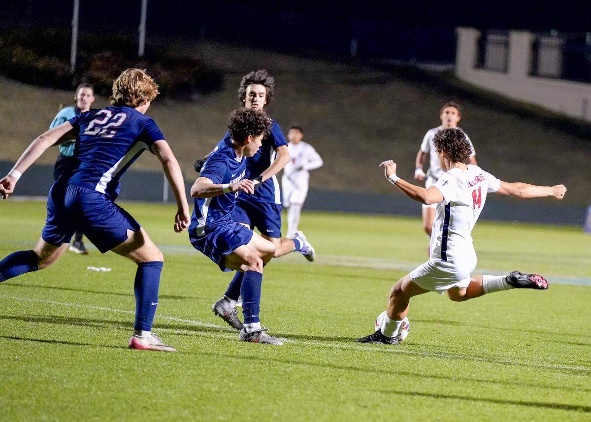 Columbus’ Ezequiel Bartra winds up to kick the game-winning goal during the Class 7A state championship game Wednesday at Spec Martin Stadium in DeLand, Fla.