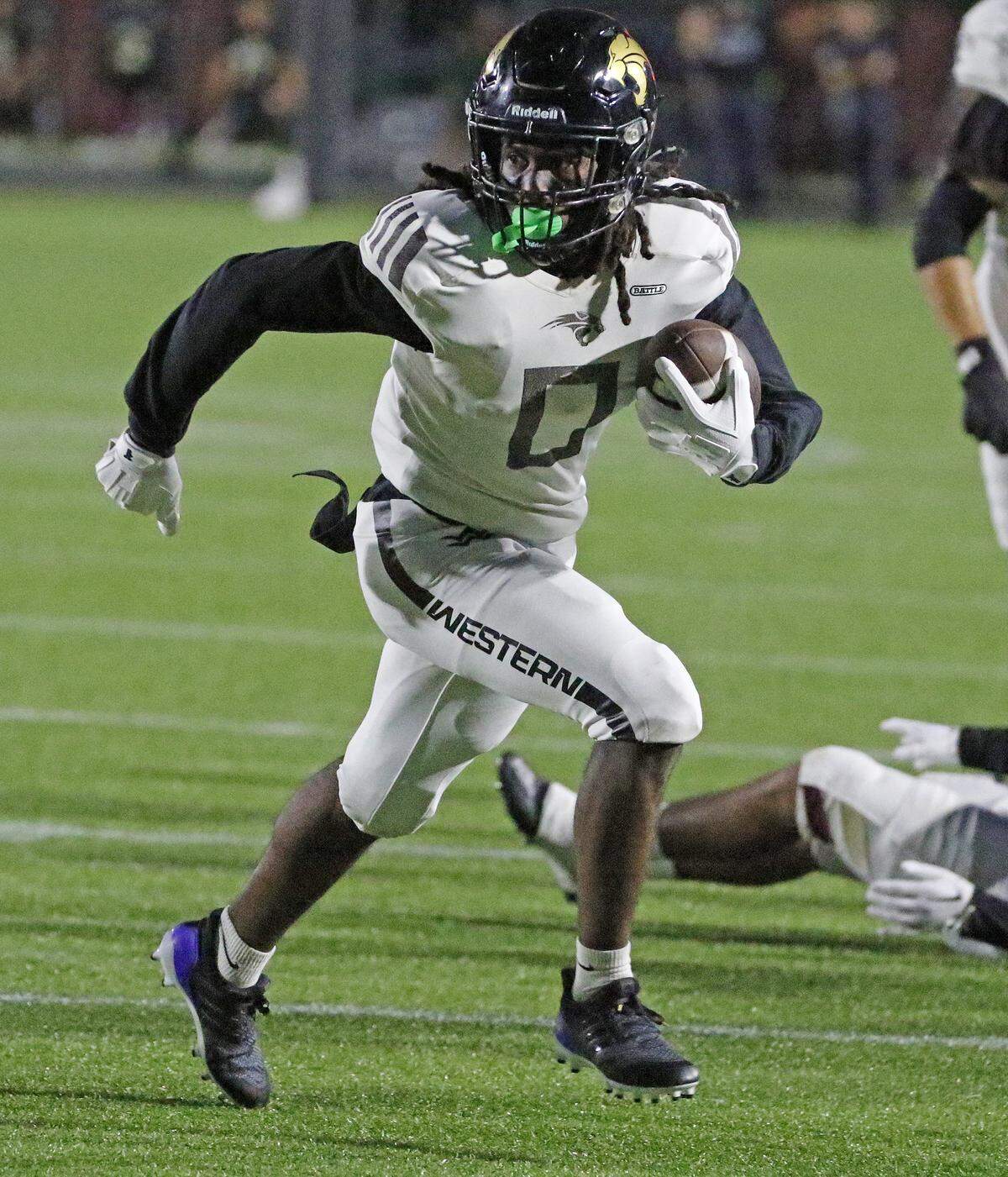 Western Wildcats Caleb Williams (0) runs to score a touchdown against Goleman Gators during their game on Friday , October 10, 2025 at Milander Park Ted Hendricks Stadium in Hialeah.