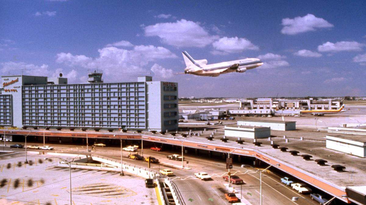 An Eastern Airlines L-1011 TriStar takes off from Miami International Airport. The tower is at left.